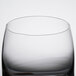 A close up of a clear Reserve by Libbey Symmetry Rocks glass with a black rim.