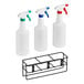 A metal rack holding three Lavex spray bottles with assorted color caps.