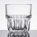 A close up of a Libbey Everest clear glass with a faceted rim.