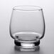 A Libbey stackable rocks glass with a black base on a white surface.