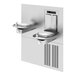 A stainless steel Haws Recessed Bottle Filler with two faucets over two water bowls.