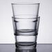 Two Libbey stackable rocks glasses on a white table.