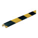 A close-up of a black and yellow striped Ideal Warehouse Knuffi corner guard.