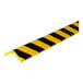 A close-up of a black and yellow striped Ideal Warehouse Knuffi Type H+ Flex Corner Guard.