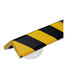 A close-up of a black and yellow striped Ideal Warehouse corner guard.
