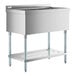 A stainless steel Regency utility sink with a shelf on legs.