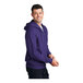 A man wearing a purple Port & Company full-zip hoodie.