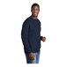 A man wearing a Port & Company navy core fleece sweatshirt.