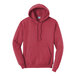 A heather red Port & Company core fleece pullover hoodie with a hood.