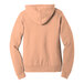 A close-up of a peach Bella + Canvas hoodie with a hood.