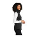 A woman wearing a deep black Port Authority fleece vest.