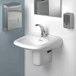 A black sink with a silver faucet and a mirror above it.
