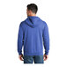 A man wearing a heather blue Port & Company Core Fleece full-zip hoodie.