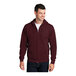 A man wearing a maroon Port & Company full-zip hoodie.