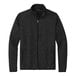 A black Port Authority fleece sweater jacket with a zipper.