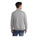 A man wearing a Port & Company athletic heather quarter-zip pullover sweatshirt.