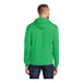 A man wearing a green Port & Company Core Fleece pullover hoodie.