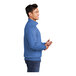 A man wearing a Port & Company heather royal quarter-zip pullover.