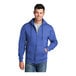 A man wearing a Port & Company heather royal full-zip hoodie.