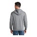 A man wearing a Port & Company athletic heather grey full-zip hoodie.