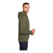 A man wearing a Port & Company Olive Drab Green Core Fleece pullover hoodie.