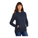 A woman wearing a navy Port & Company Core Fleece pullover hoodie.