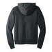 A person wearing a dark gray Bella + Canvas sponge fleece pullover hoodie with the hood up.