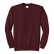 A maroon Port & Company Core Fleece sweatshirt with a white logo on the front.
