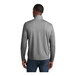 A man wearing a Sport-Tek dark gray heather quarter-zip pullover sweatshirt.