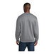 A man wearing an athletic heather Port & Company core fleece sweatshirt.
