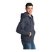 A man wearing a Port & Company heather navy full-zip hoodie.