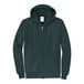 A Port & Company dark green zip-up hoodie.