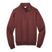 A close-up of a maroon Port & Company Core Fleece quarter-zip sweatshirt.