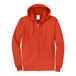 An orange Port & Company zip up hoodie sweatshirt.