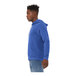 A person wearing a Bella + Canvas blue sponge fleece pullover hoodie