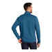 A man wearing a blue Port Authority fleece sweater jacket with a half-zip.