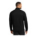 A man wearing a Port Authority black quarter-zip sweatshirt.