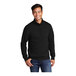 A man wearing a black Port & Company quarter-zip pullover.