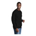 A man in a black Port & Company Core Fleece sweatshirt.