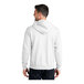 A man wearing a white Port & Company full-zip hoodie.