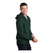 A man wearing a dark green Port & Company full-zip hoodie.