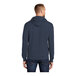 A man wearing a navy Port & Company Core Fleece pullover hoodie.