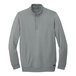 A TravisMathew unisex grey long sleeved 1/4 zip pullover sweatshirt.