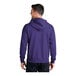 A man wearing a purple Port & Company full-zip hoodie.