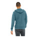 A man wearing a Bella + Canvas heather deep teal hoodie.