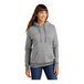 A woman wearing a Port & Company athletic heather pullover hoodie.