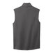 A close-up of a graphite Port Authority fleece vest.