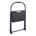 A blue step stool with a black handle.