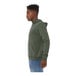 A man wearing a Bella + Canvas military green sponge fleece pullover hoodie.