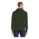 A man wearing a Port & Company olive green core fleece pullover hoodie.